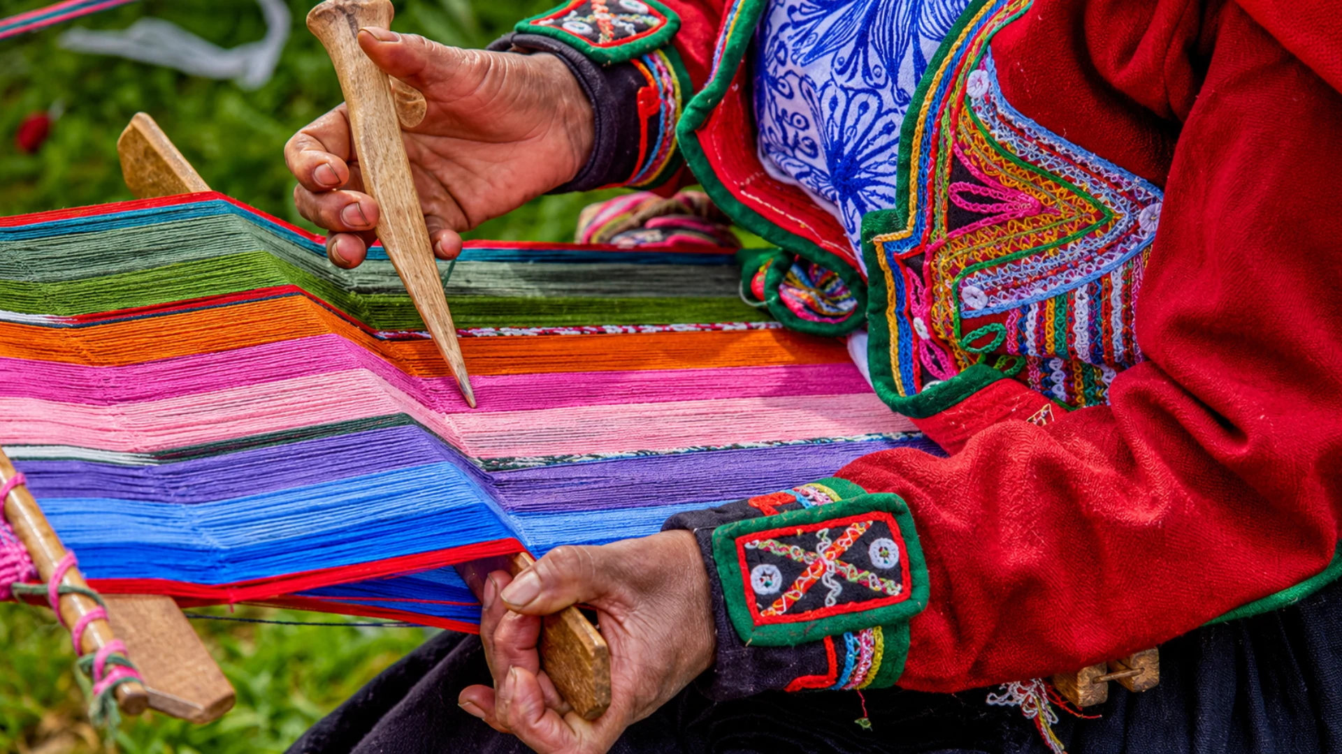 A woman knitting using a traditional technique
