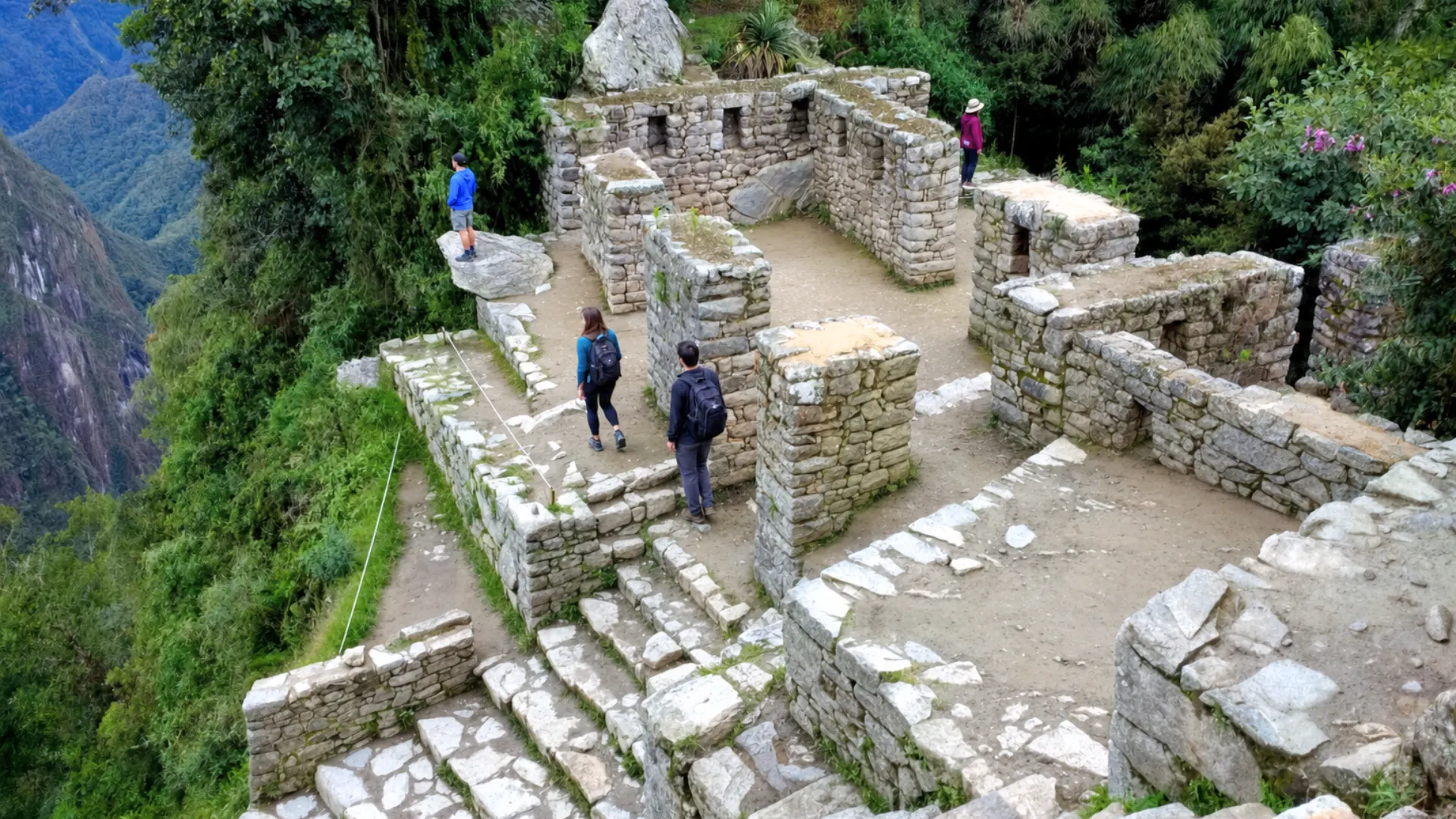 Hikers arriving at the Sun Gate after completing the Inca Trail