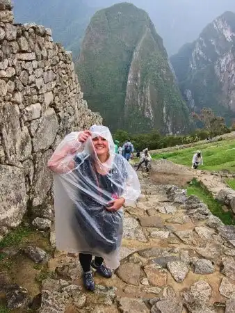 Tourist wearing rain poncho at Machu Picchu