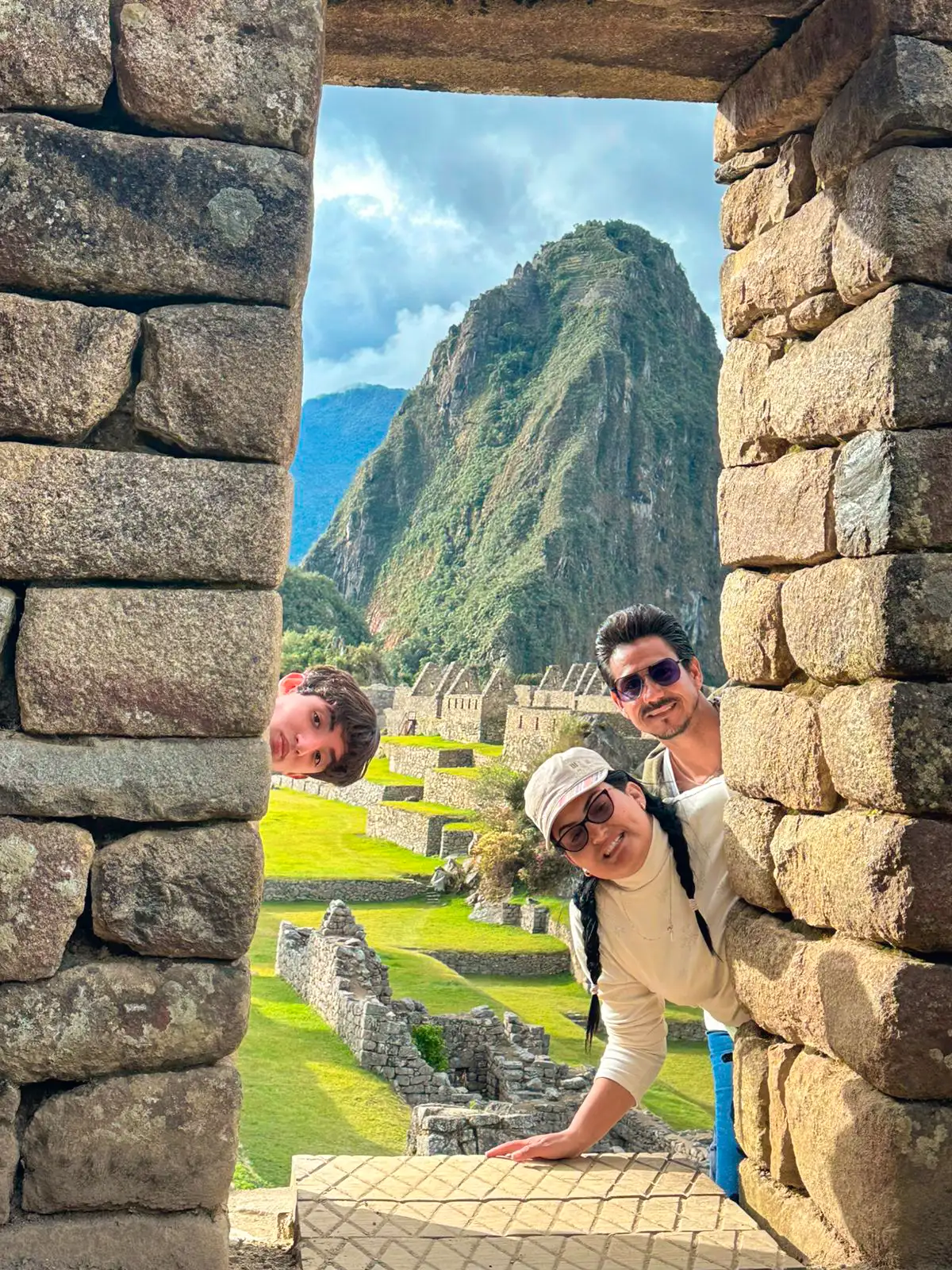 Travelers at Machu Picchu with ruins