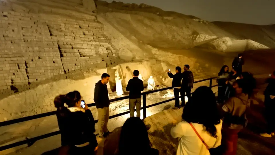 Tourists enjoying a night tour at Huaca Pucllana