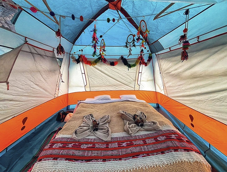Comfortable beds inside the Luxury Inca Trail 5 Days 4 Nights campsite, featuring exclusive design and full amenities for a premium experience in Cusco, Peru