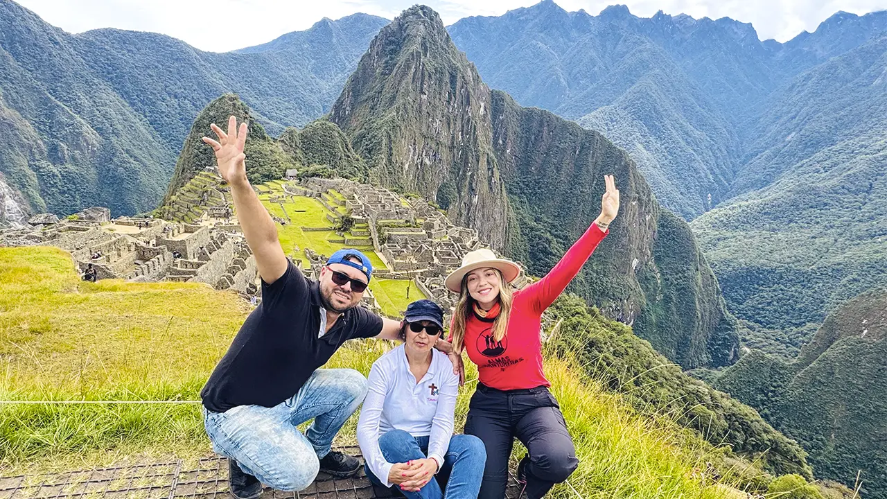 Panoramic view of Machu Picchu with tourists at the Inca citadel