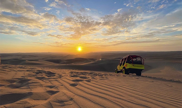 Natural oasis in Peru, Huacachina with Uros Expeditions, a beautiful lake surrounded by dunes and palm trees in the Ica desert