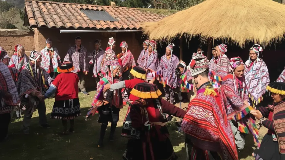 Travelers enjoying an Andean family celebration during an experiential tourism visit, photo credits to the author.