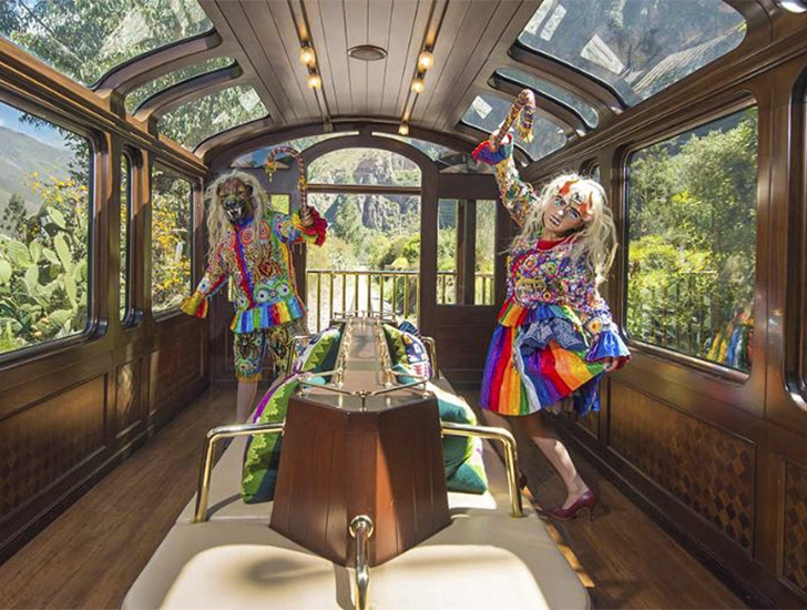 Traditional dances aboard the Vistadome Observatory Train by PeruRail on the way to Machu Picchu