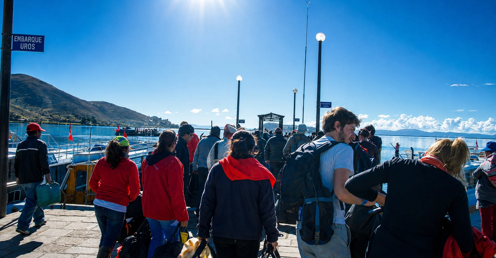 Travelers boarding a Lake Titicaca tour boat at Puno port