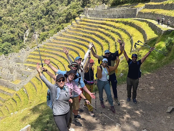View of the Wiñay Wayna archaeological site during the Inca Trail 4 Days 3 Nights tour, featuring Inca terraces surrounded by lush vegetation and mountains in Cusco, Peru