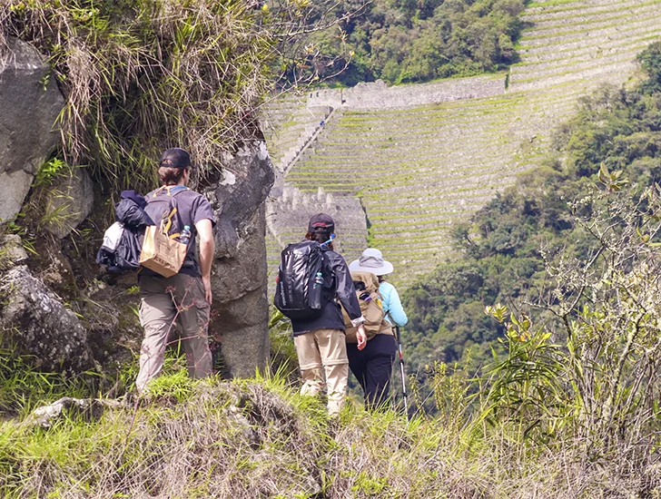 View of the Wiñay Wayna archaeological site on Day 1 of the Short Inca Trail, featuring Inca terraces and a stunning overlook of the Urubamba Valley.